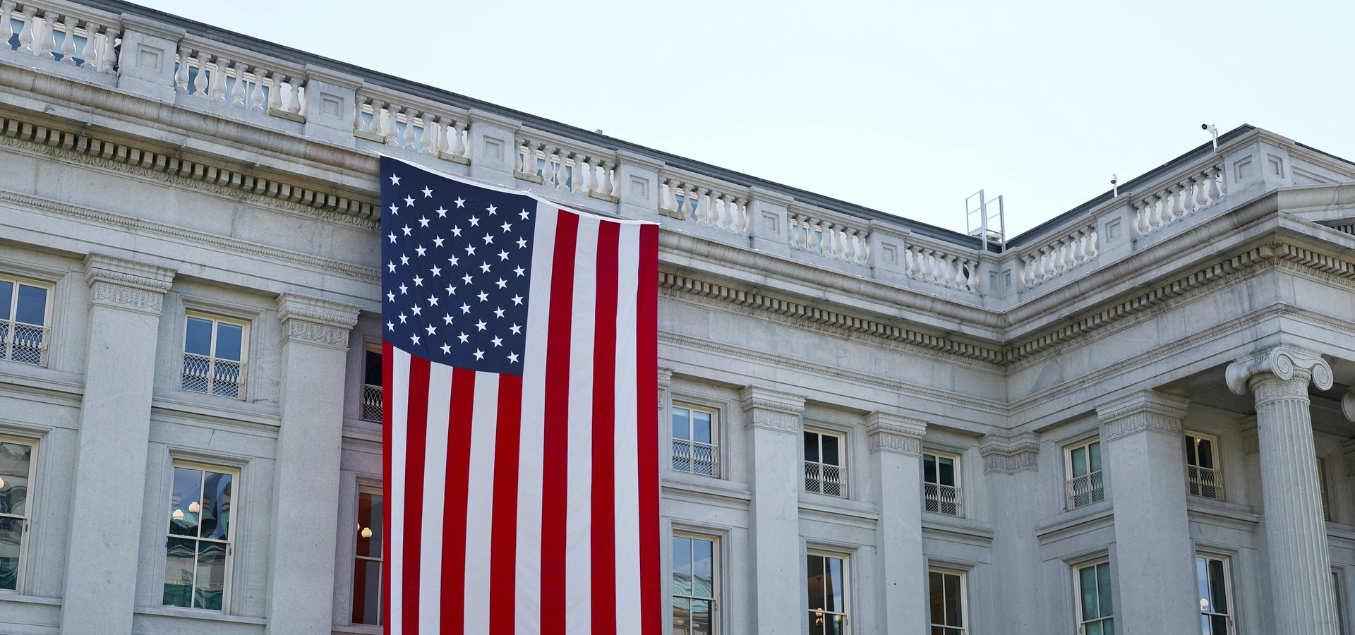 American Flag on Government Building Facade